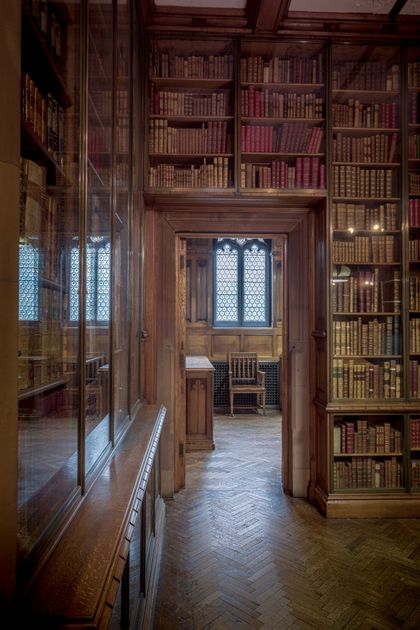 Bookshelf passageway inside a historic reading room — Michael D Beckwith on Pexels