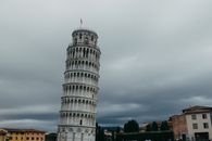 Iconic Leaning Tower of Pisa with overcast skies in Pisa, Italy.
