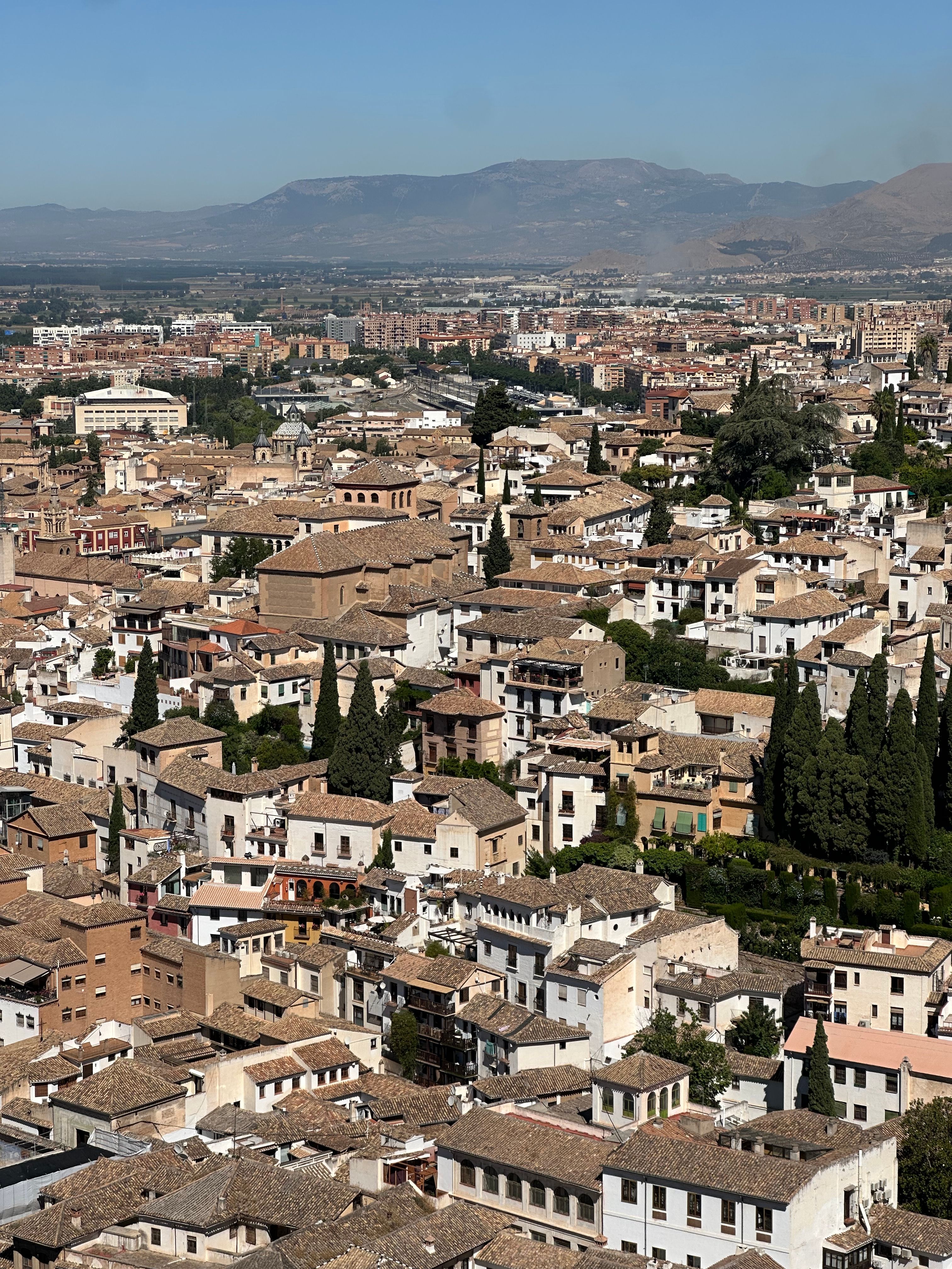 Breathtaking aerial view of Granada's historic district showcasing traditional architecture and cityscape.