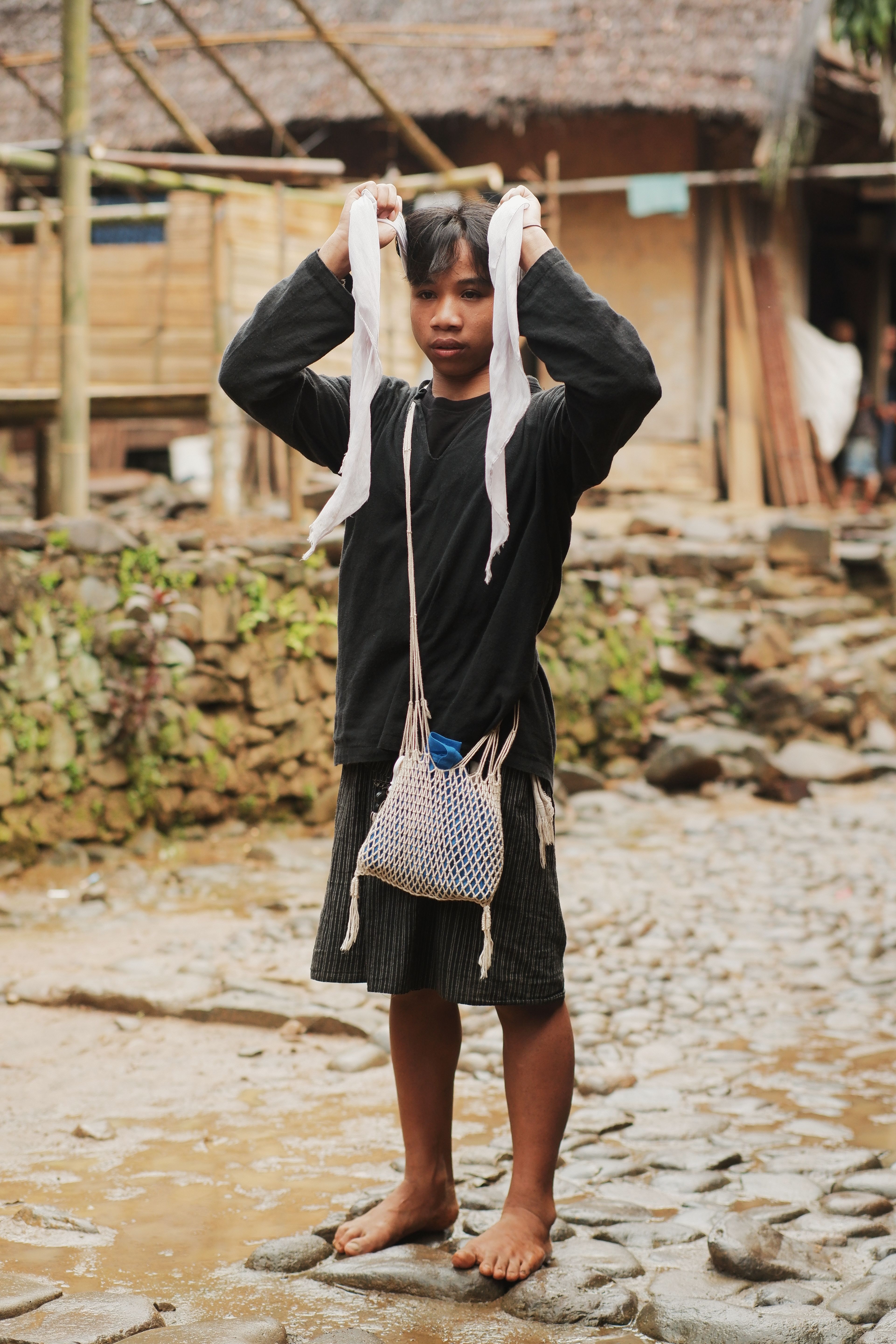 Young boy in traditional Banten village attire, showcasing local culture and lifestyle.
