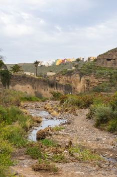 Vibrant colored houses and natural gorge in Canary Islands, Spain.