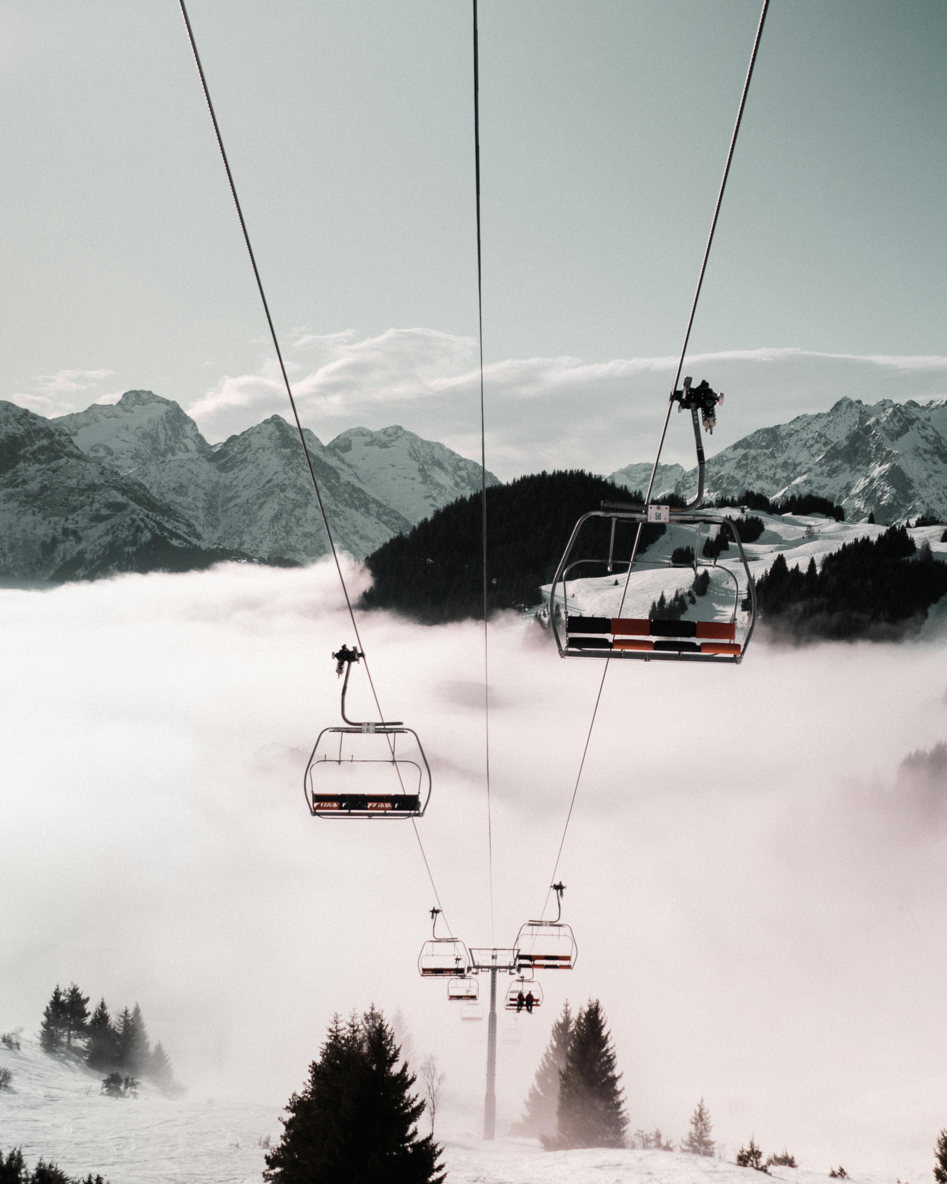 cable car near snow covered mountain