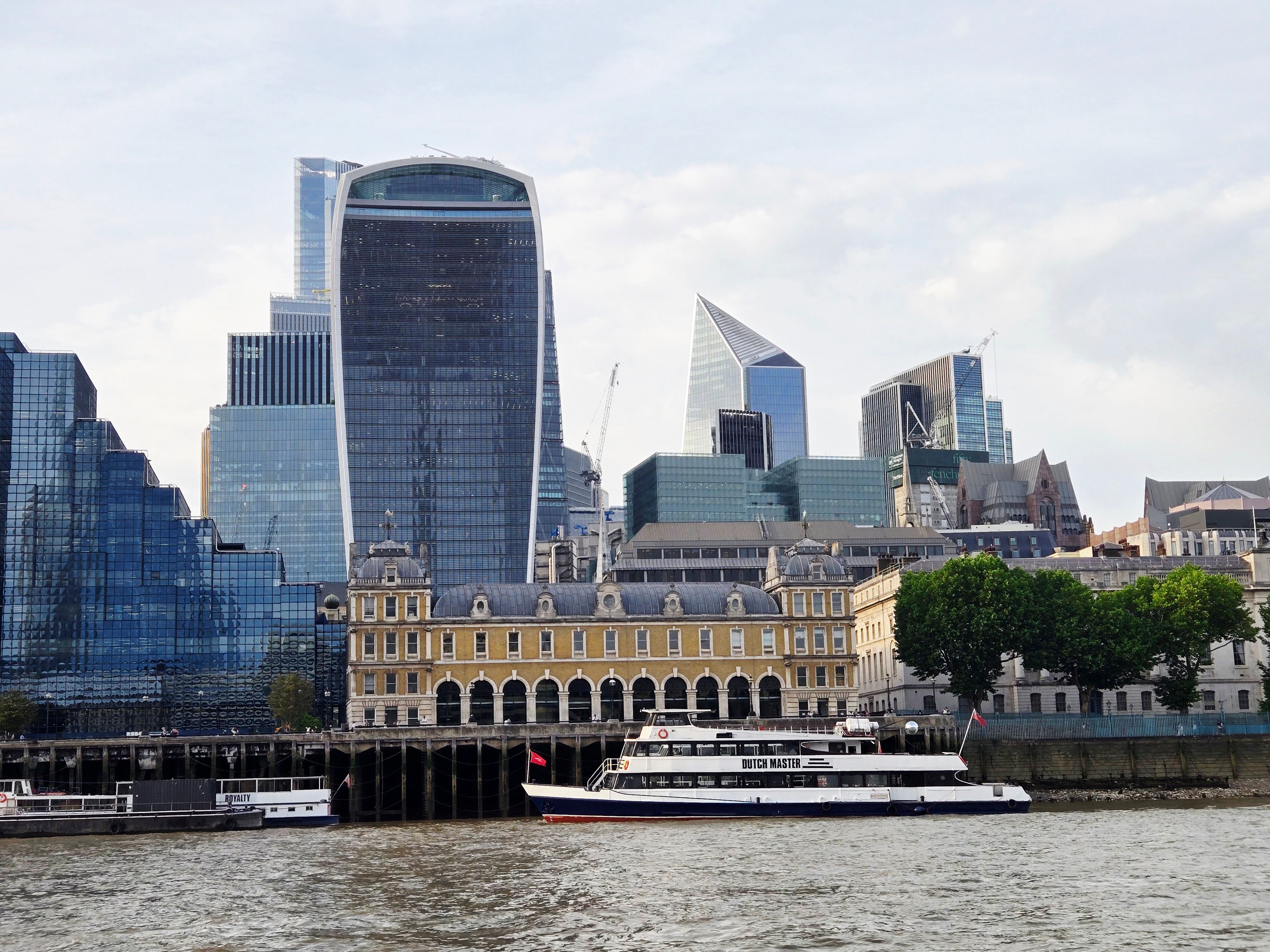View of London's modern skyline featuring the Walkie Talkie building and Thames River.