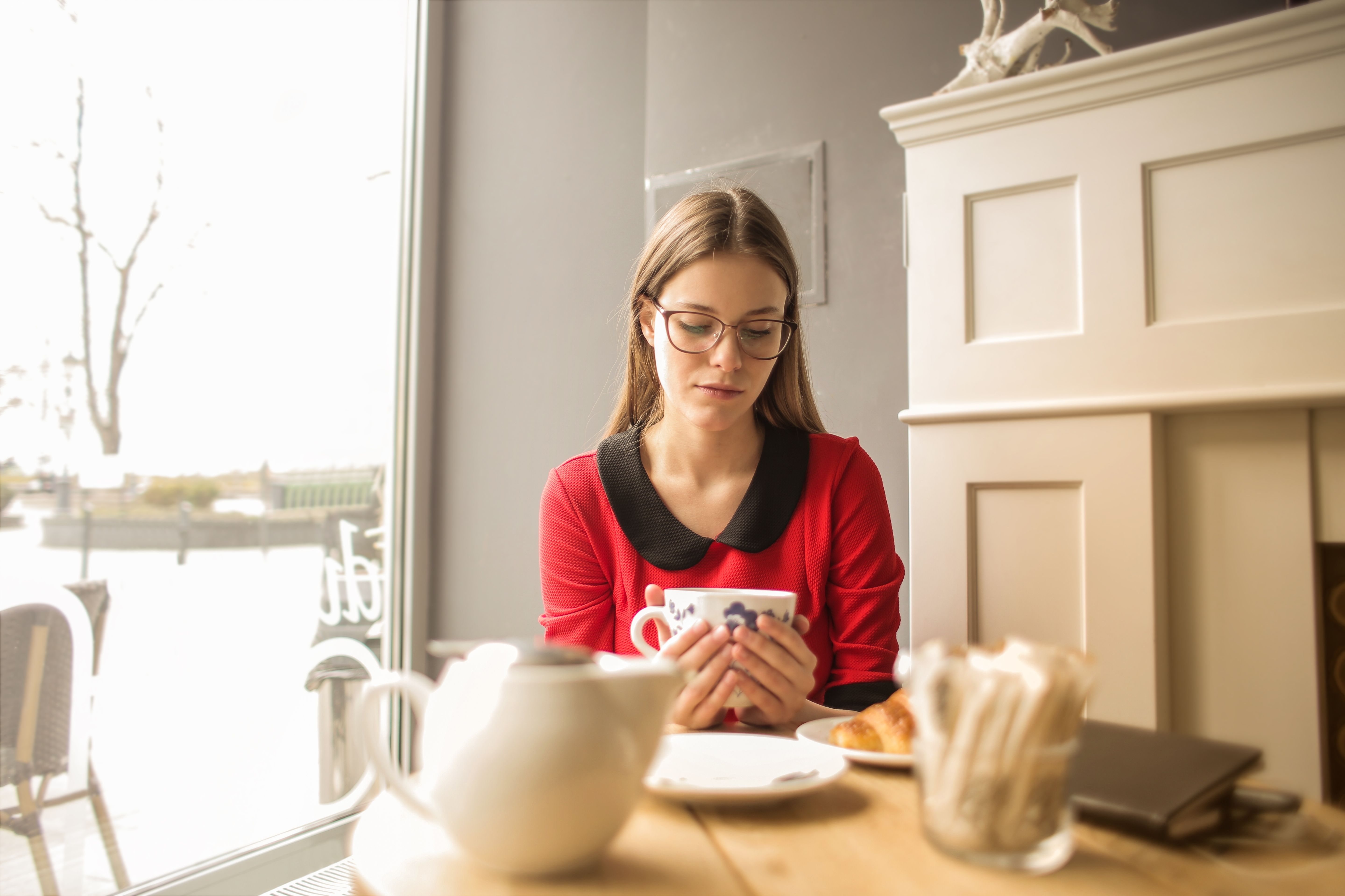 Woman In Red Long Sleeve Holding White Ceramic Mug · Free Stock Photo