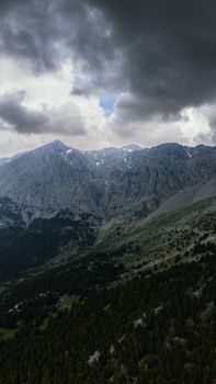 Dramatic clouds over Mount Parnassus, Greece, showcasing nature's raw beauty and grandeur.