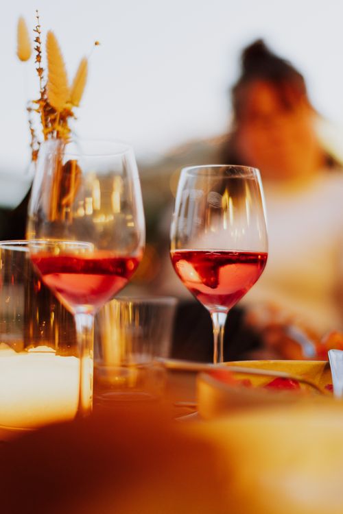 Free Two glasses of rosé wine in Athens, Greece, during a warm sunset. Stock Photo
