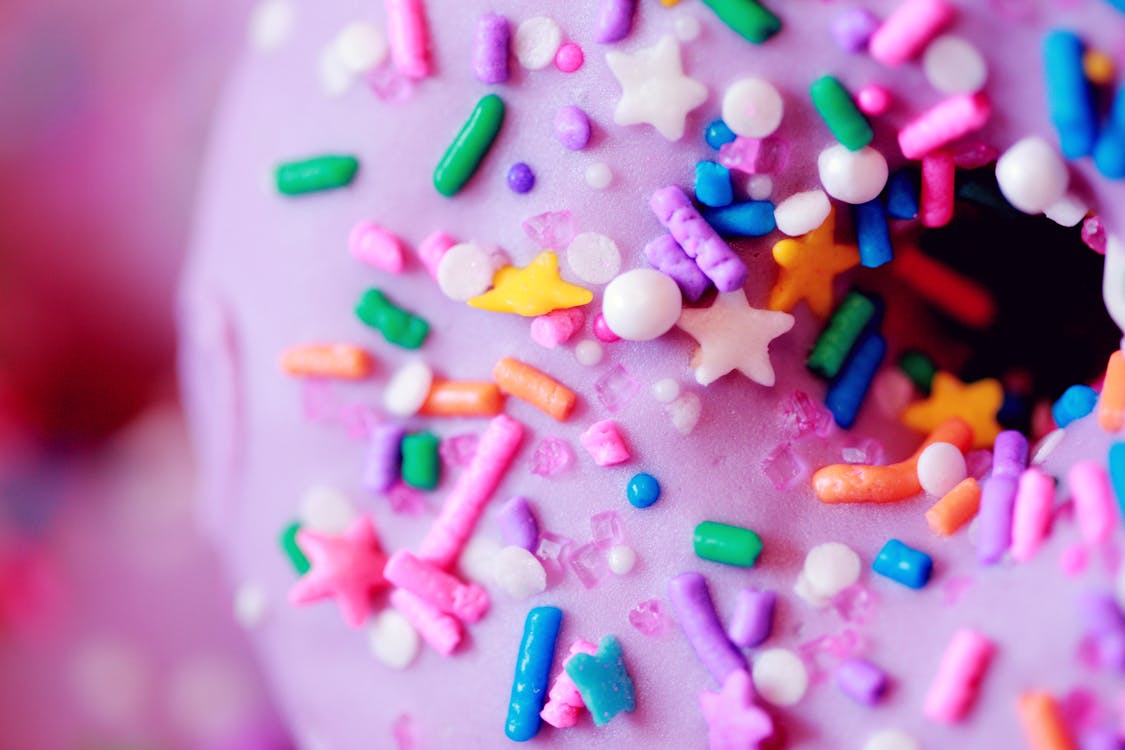 Free Pink Doughnut with Colorful Sprinkles inTilt-shift Lens Stock Photo
