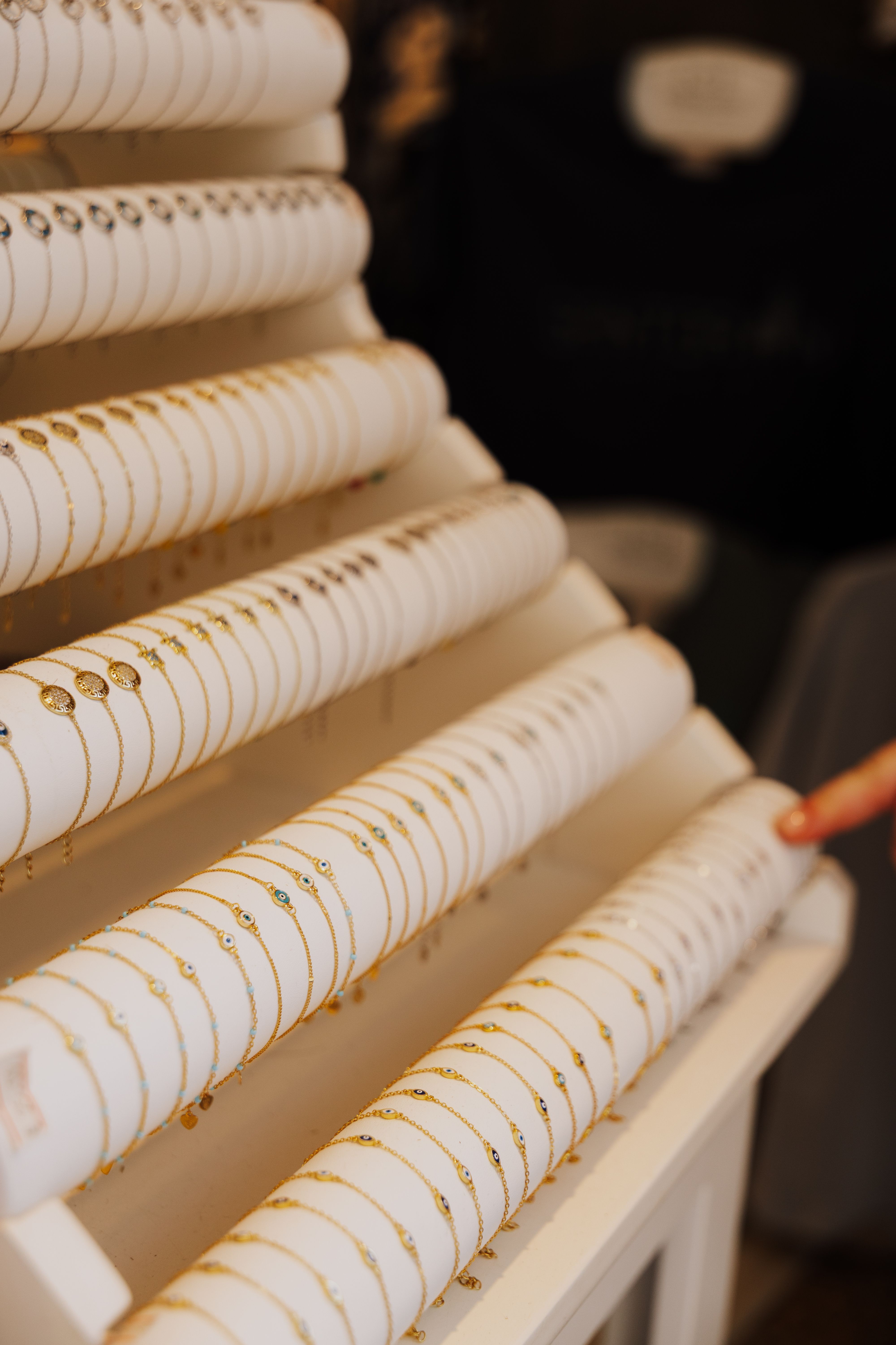 Array of gold bracelets on display