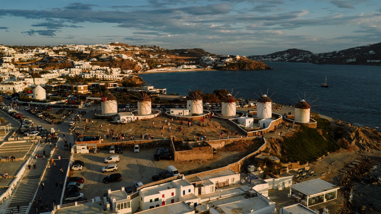Mykonos Inception Scenic Aerial View of Mykonos Windmills at Sunset · Free Stock Photo