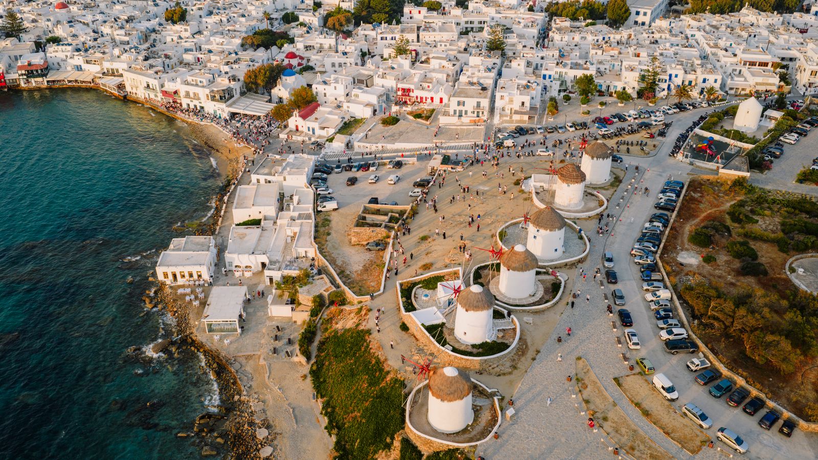 Mykonos town aerial harbour Little Venice windmills sunset