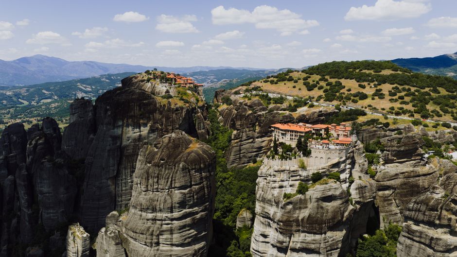 Ultimate Santorini 30min Helicopter Tour Review: Soaring Above Greece's Most Iconic Island Review 2026 - Stunning aerial shot of Meteora monasteries perched on rocky cliffs in Greece's landscape.