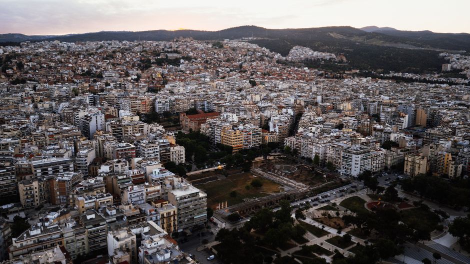Stunning Private Helicopter Transfer from Mykonos to Santorini Review 2026 - A sprawling aerial view of Thessaloniki, capturing the dense urban landscape under daylight.
