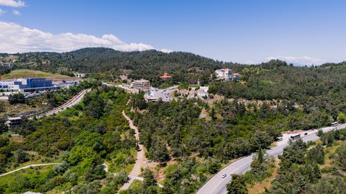 Free Explore the lush, green landscapes and winding roads of Thessaloniki from above. Stock Photo