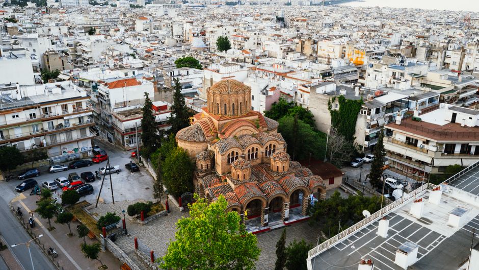 Unbeatable Athens Helicopter Sightseeing Tour | Private Review: The Ultimate Way to Experience Greece's Ancient Capital Review 2026 - Capture of a Byzantine church in Thessaloniki, Greece from above, surrounded by city buildings.