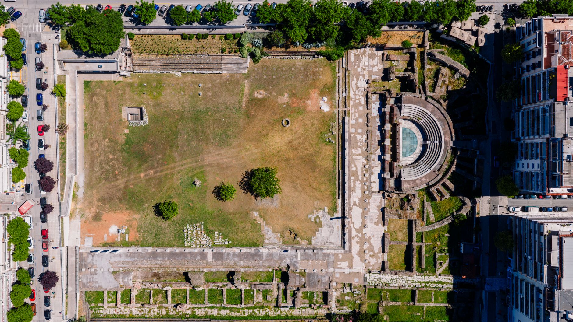 Aerial shot of Roman Agora ruins in Thessaloniki, Greece, highlighting ancient structures.