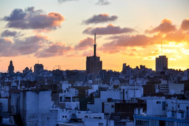 Stunning view of Montevideo's skyline during sunset, showcasing urban architecture and vibrant skies.