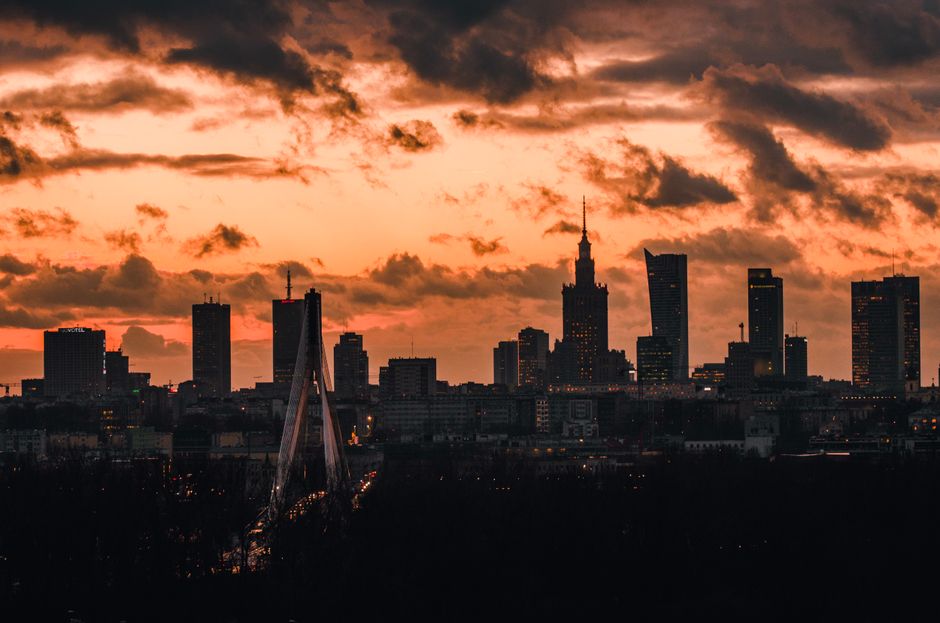 A modern skyline of Warsaw, Poland, representing urban exploration and the peace of mind travel insurance provides.