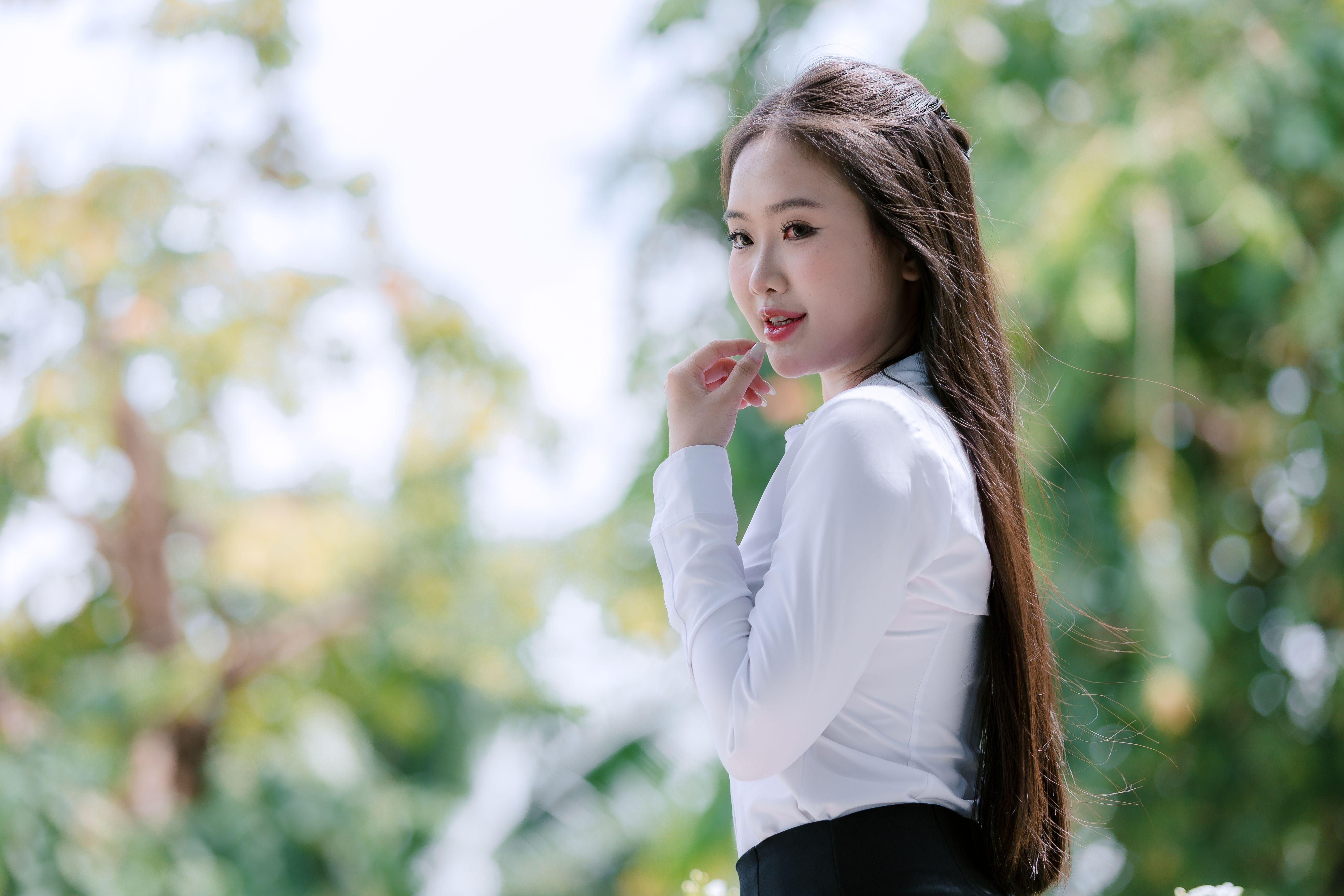 Portrait of a Woman in White Shirt Outdoors · Free Stock Photo