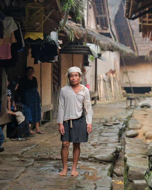 Free Portrait of a traditional villager standing in a rural village in Banten, Indonesia, showcasing local culture. Stock Photo