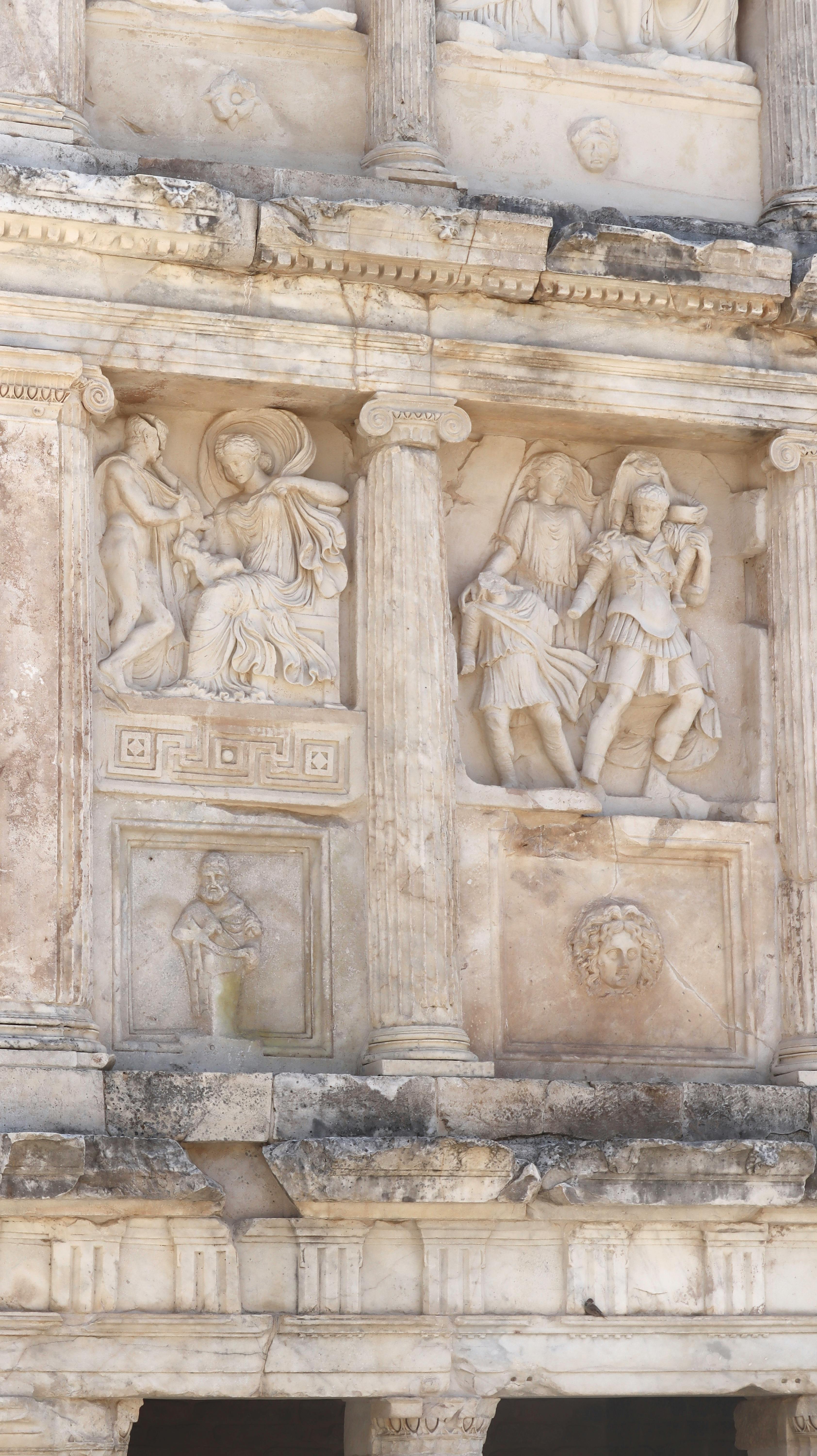 Detailed relief sculptures on the facade of ancient Ephesus Library in Aydın, Türkiye.