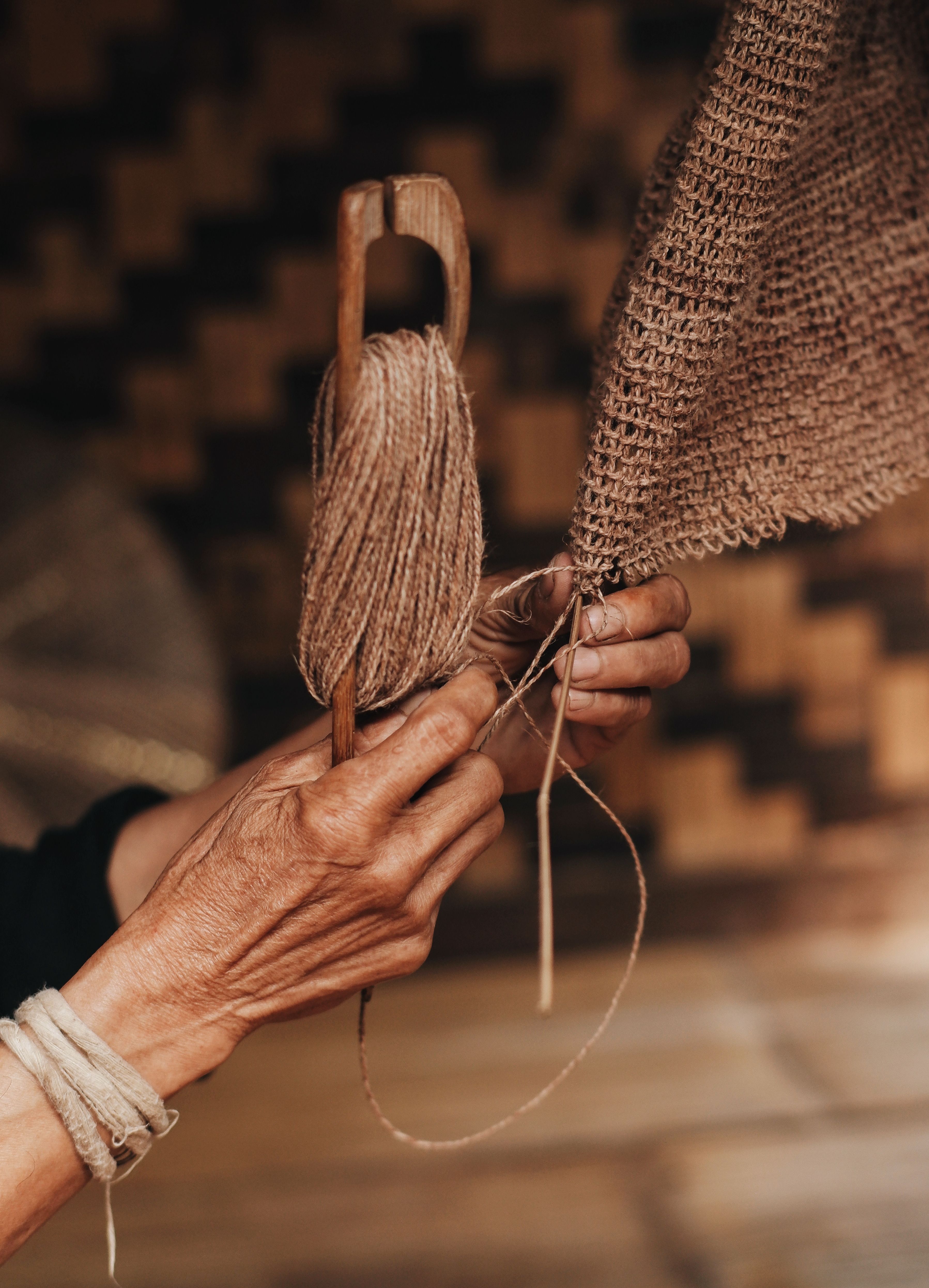Close-up of traditional weaving process in Banten, Indonesia, showcasing cultural craftsmanship.