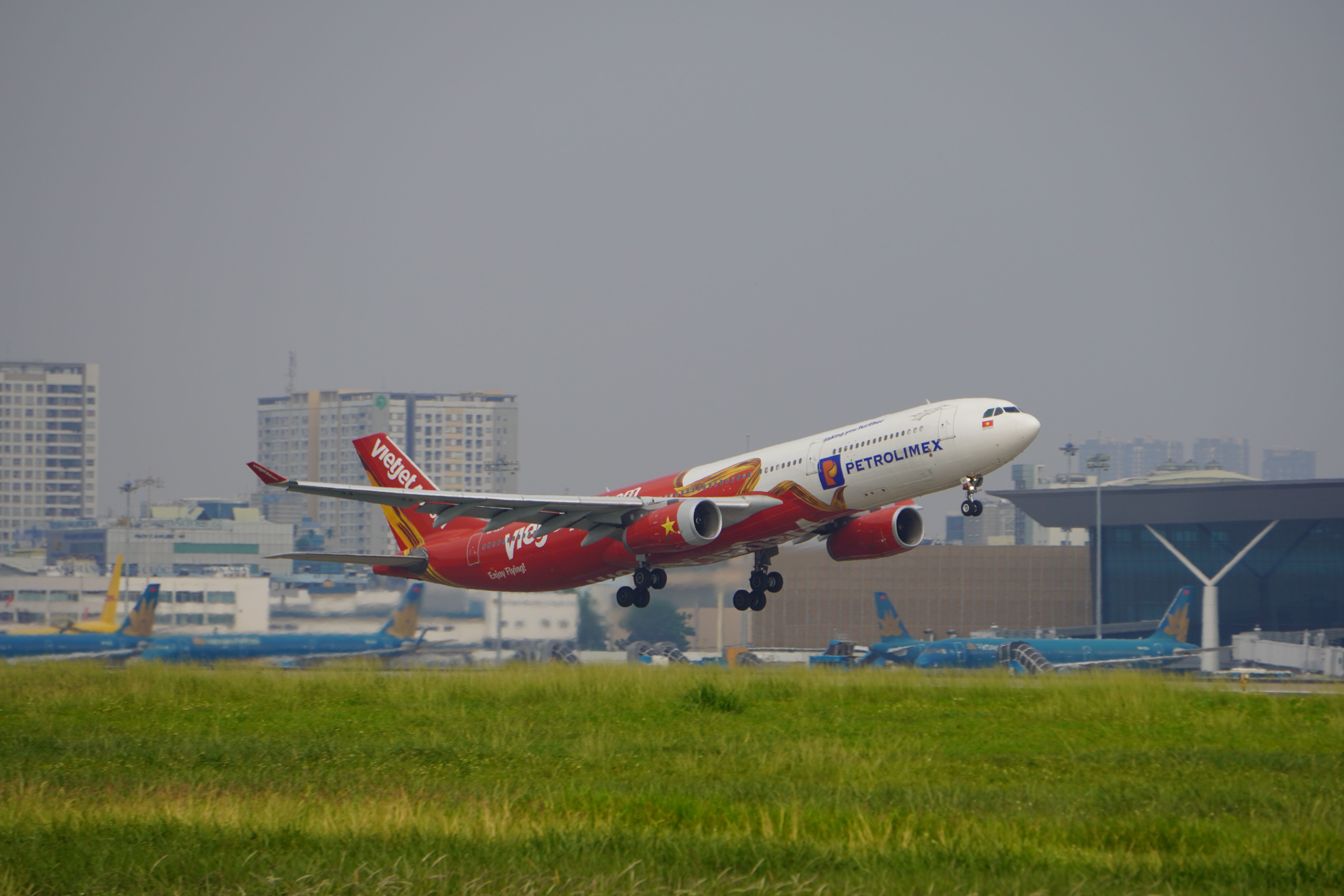 Airport Express Bus 86 parked outside Noi Bai International Airport in Hanoi, Vietnam