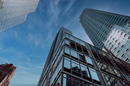 Free A captivating view of New York City's modern skyscrapers against a clear blue sky, showcasing urban architecture. Stock Photo