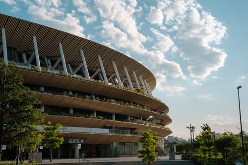 Free Contemporary view of a Tokyo stadium showcasing modern architecture against a clear sky. Stock Photo