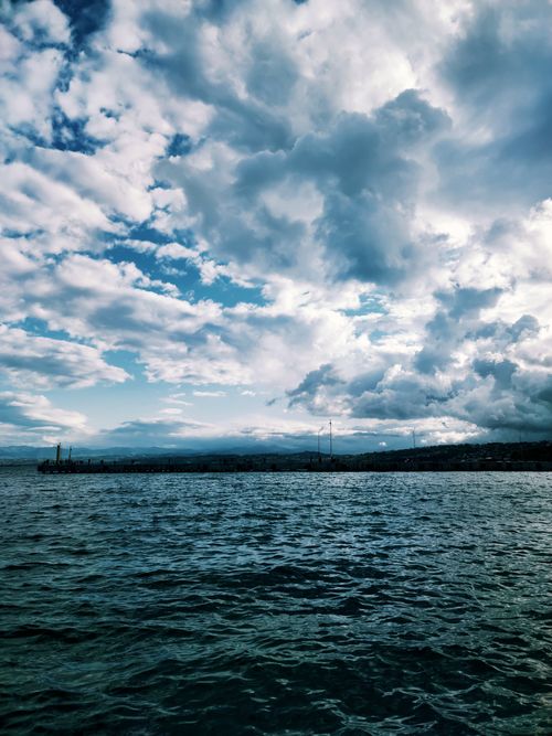 Free Captivating view of dramatic clouds over the sea at Sinop harbor in Türkiye. Stock Photo