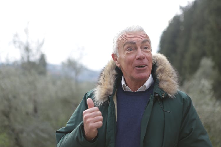 A Grateful Man In Green Parka Jacket