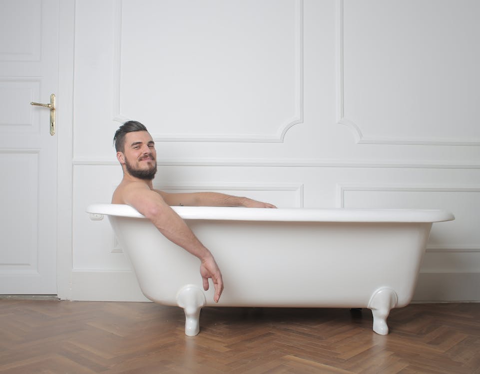 Bearded Man in Bathtub With Water