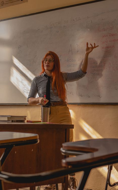 Teacher giving a lesson in a sunlit classroom