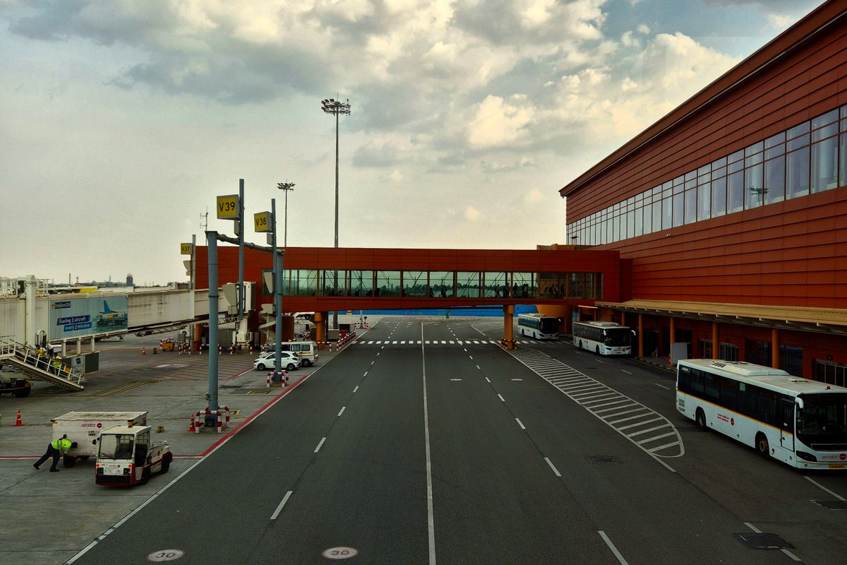 Airport terminal with buses waiting outside