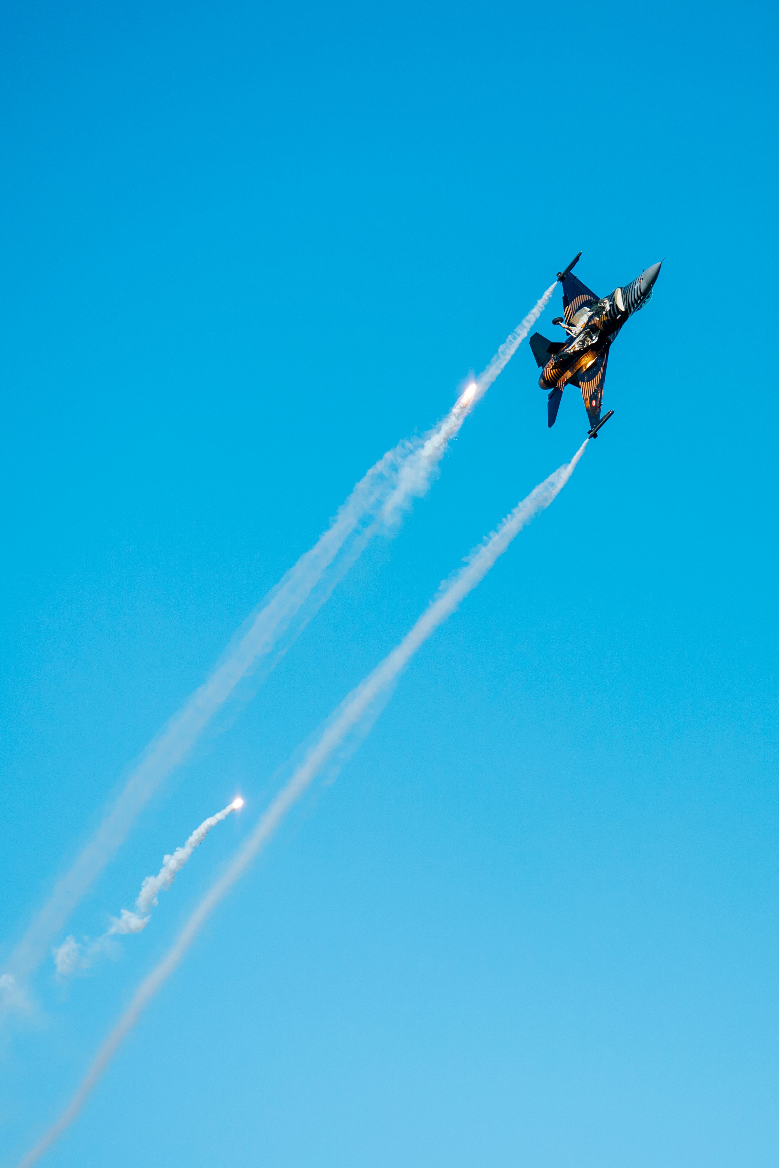 High-Performance Jet Ascends Against Clear Sky · Free Stock Photo