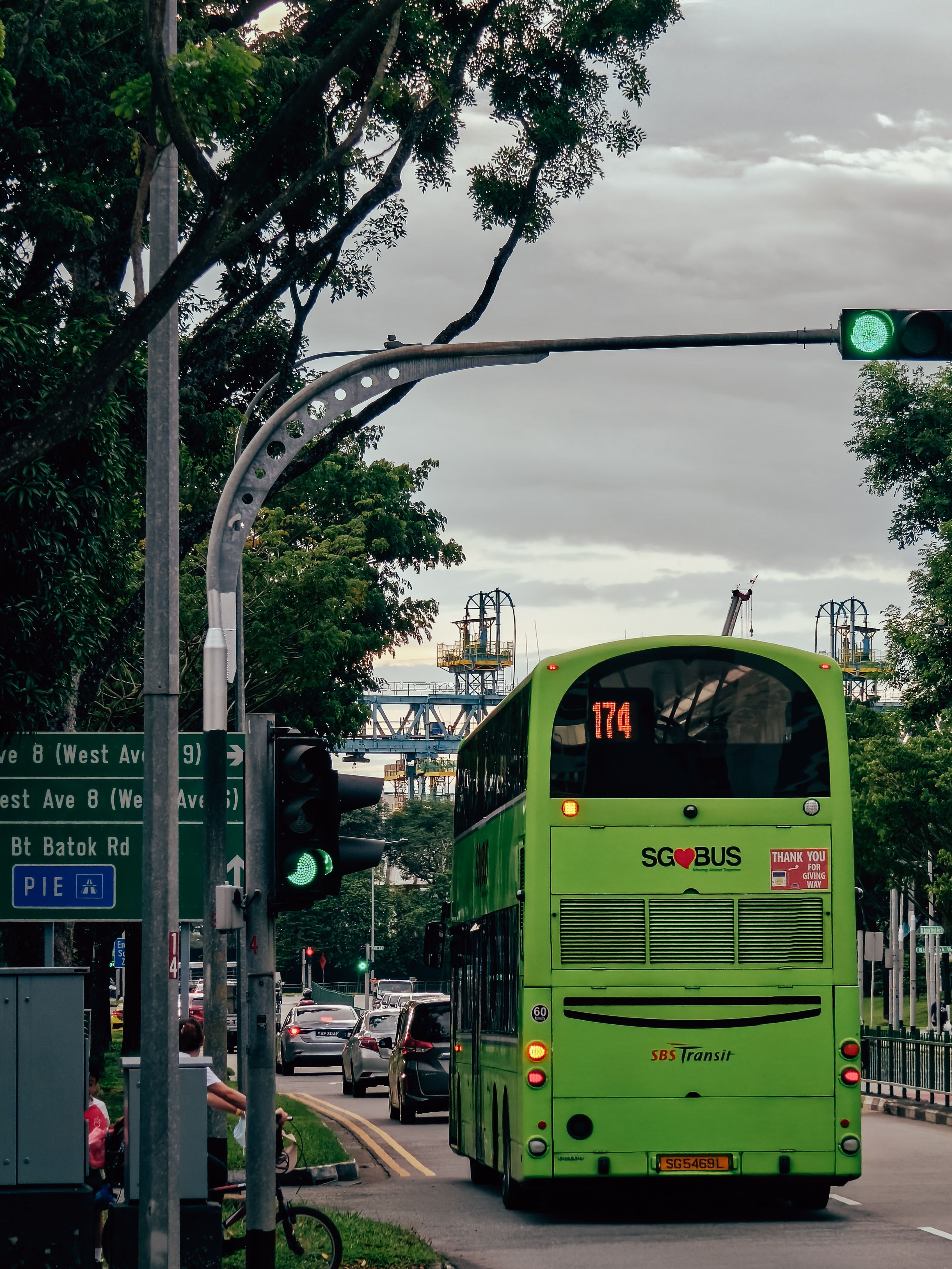 A vibrant double-decker bus in Singapore captures the essence of urban transit and city life.