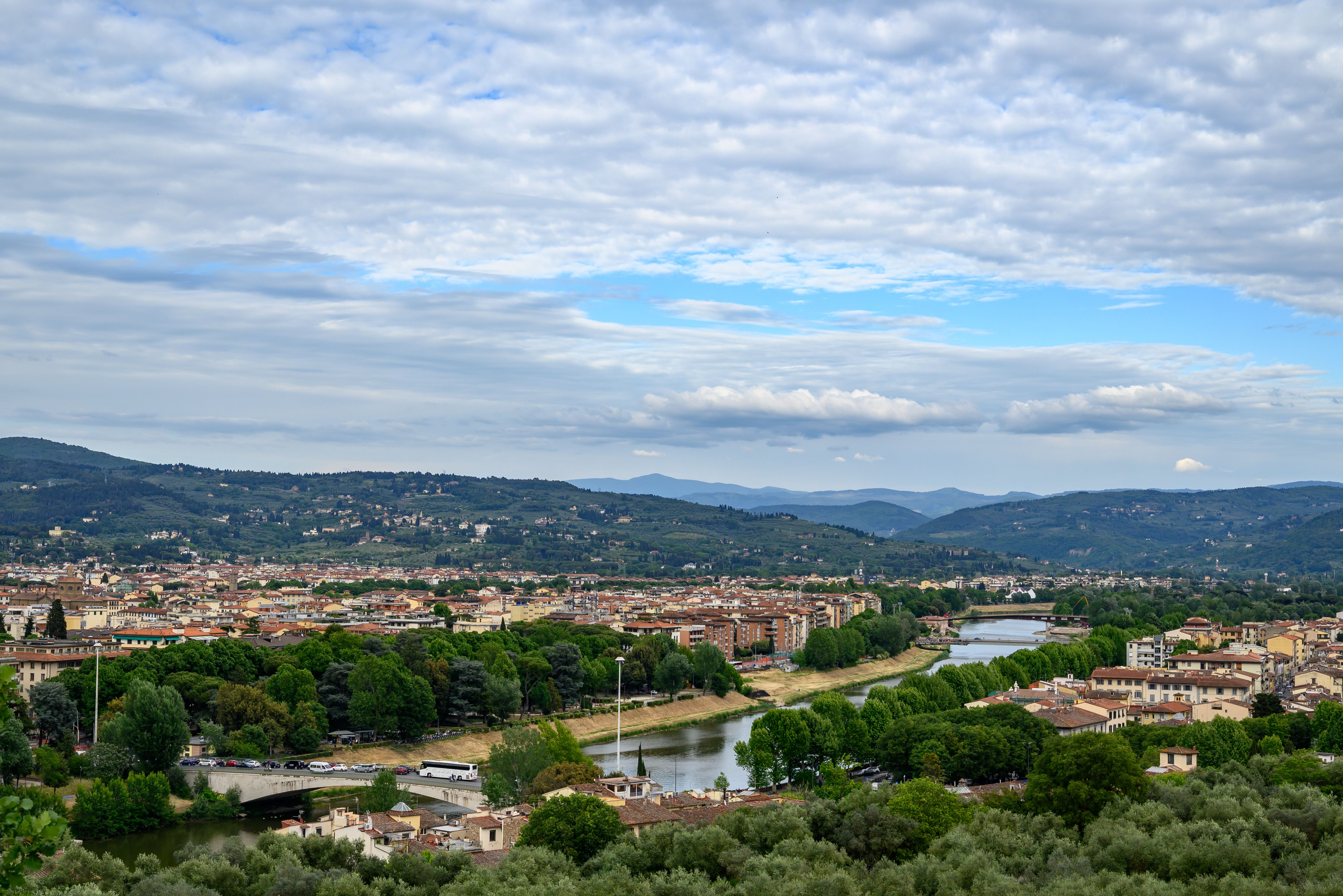 Stunning panoramic view of Florence, Italy with the winding Arno River and beautiful landscape.
