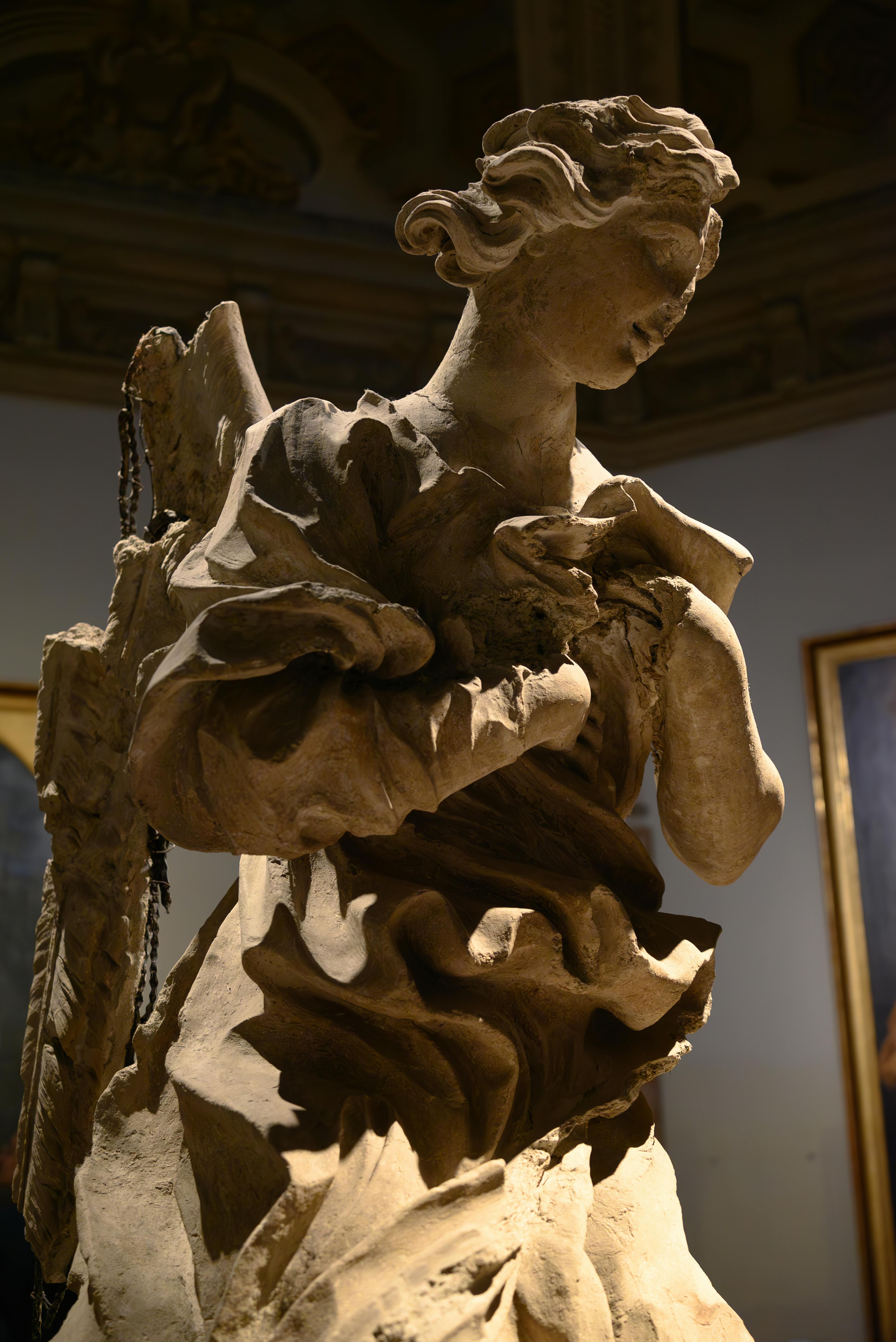 Intricate Baroque sculpted angel, captured indoors at the Vatican Museum.