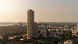 Mumbai's skyline, towers and green at sunset