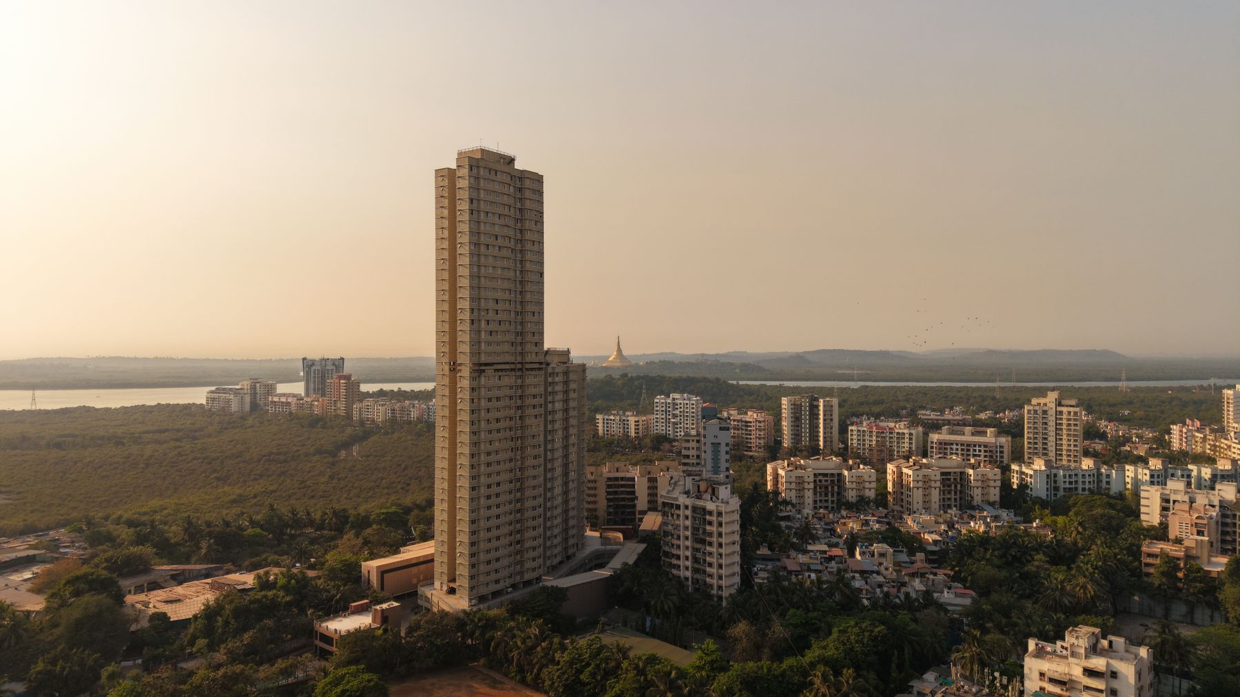 Mumbai's skyline, towers and green at sunset