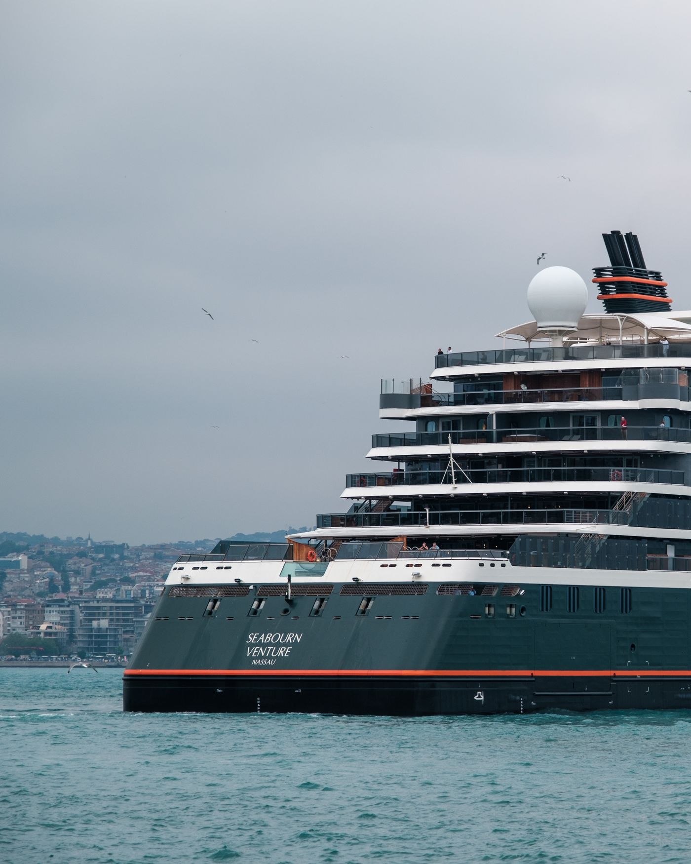 The cruise ship Seabourn Venture sailing the Bosphorus with the Istanbul skyline behind