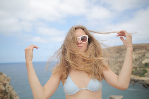 Free Woman In White Bikini Top Wearing Sunglasses Stock Photo