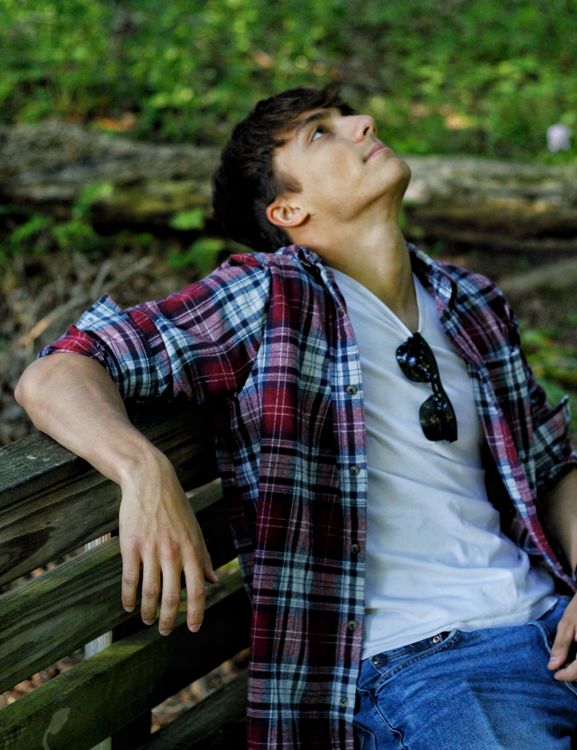 Young Man Relaxing on a Park Bench in Summer · Free Stock Photo