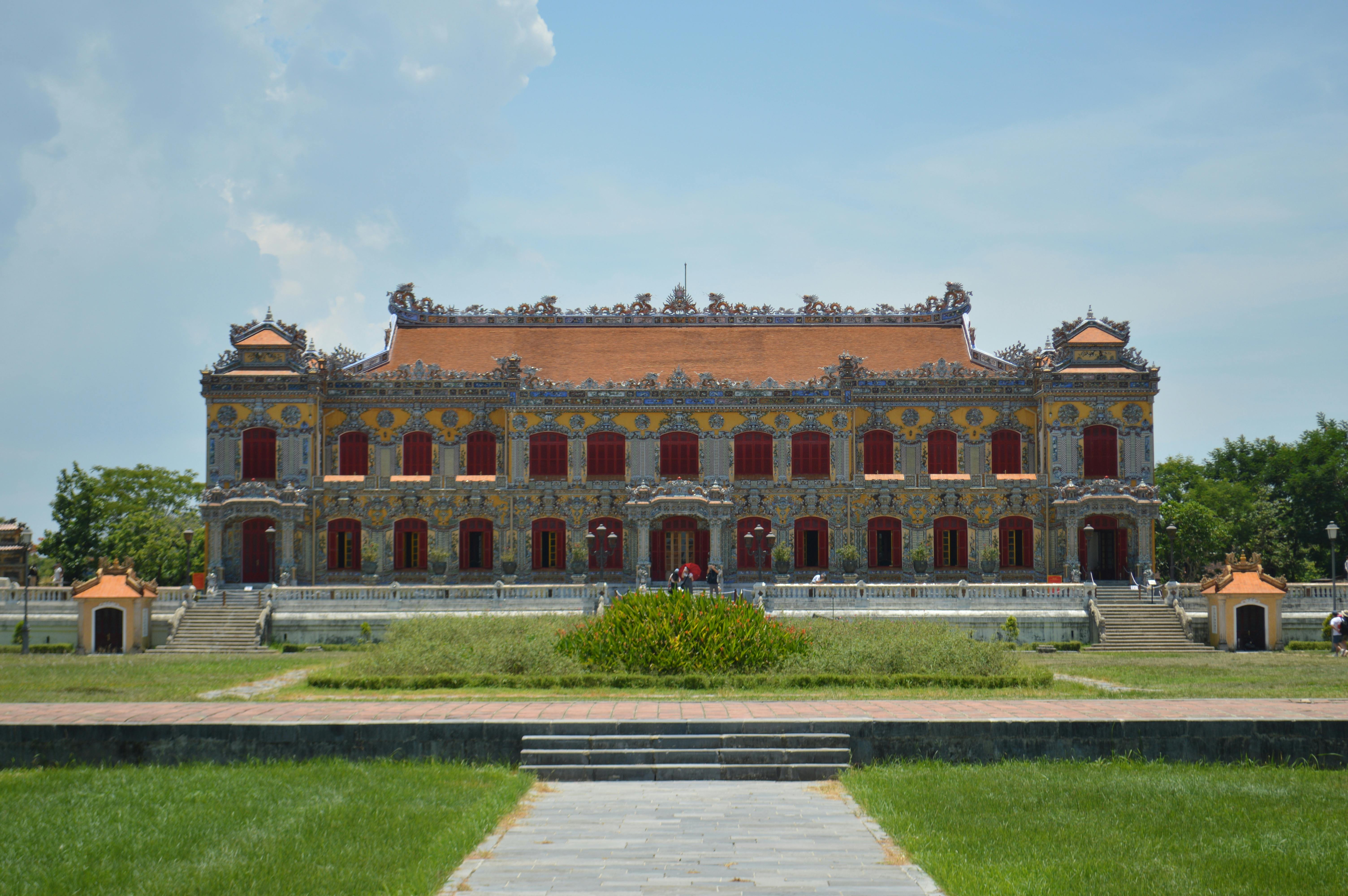 Front view of an ornate imperial building in Hue, Vietnam, showcasing intricate traditional architecture.