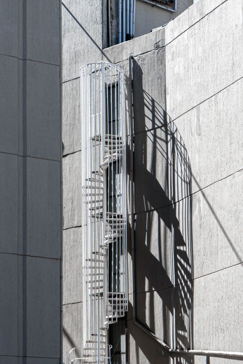Free A striking spiral staircase casting shadows on a modern building in Ankara, Turkey. Stock Photo