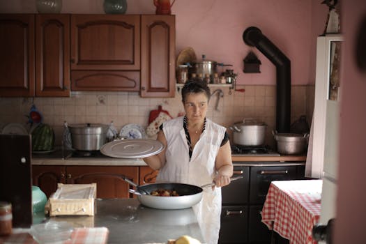 A woman cooking at home, showcasing culinary skills in a rustic kitchen setting.