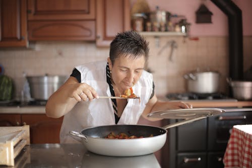 Free Photo of Woman Smelling the Food Stock Photo