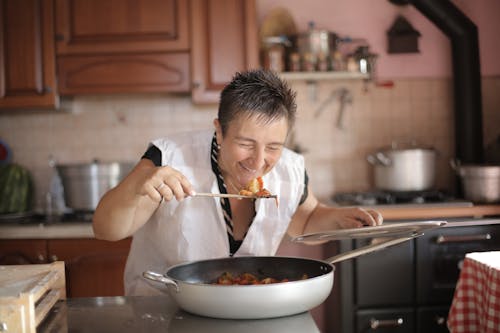 Free Photo of Woman Smelling the Food Stock Photo