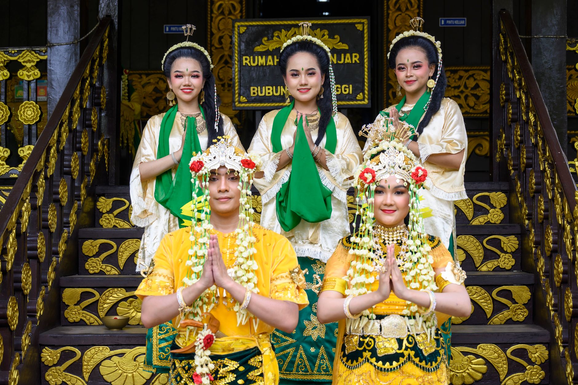 Traditional Minangkabau wedding attire worn during a ceremony in Bukittinggi, Indonesia. Cultural heritage celebration.