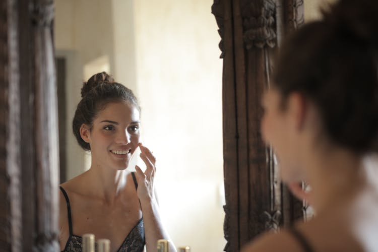 Woman Touching Her Cheek