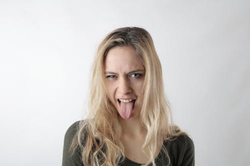 Free Woman Sticking Her Tongue Out Stock Photo